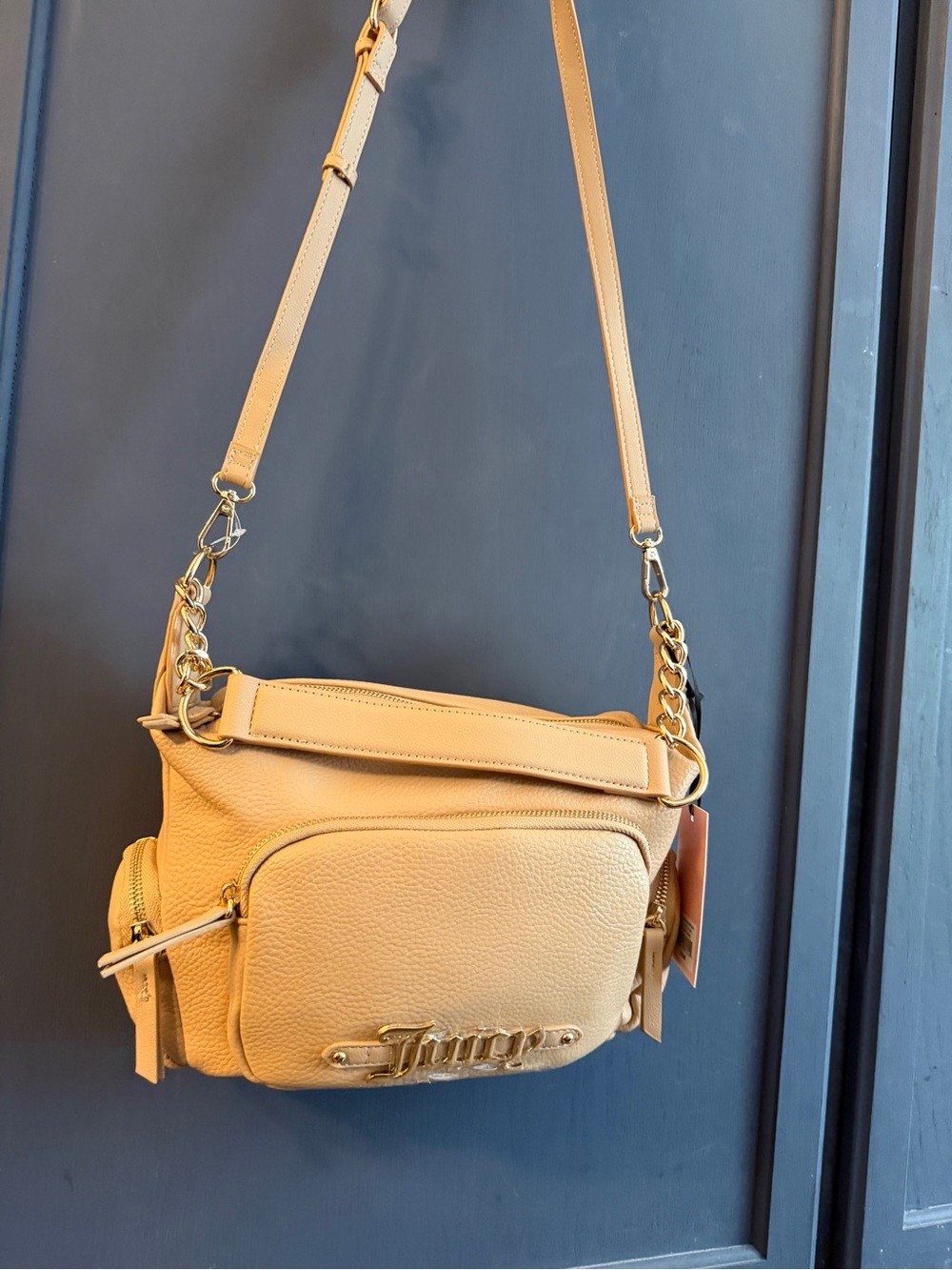 Juicy Couture crossbody/shoulder bag tan leather with front pocket.